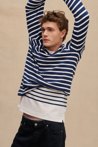 Découvrez l'authentique marinière homme Le Minor. 100% coton, fabriquée en Bretagne. Qualité durable et style marin iconique. Disponible chez CQFD Avignon.