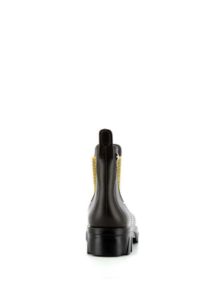 Découvrez la bottine Jultess Méduse®. Look chunky marron et noir, semelle compensée, 100% recyclable et fabriquée en France. Soyez stylée sous la pluie chez CQFD.
