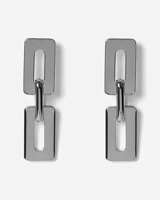 Découvrez les boucles pendantes Karl Argent de Chic Alors chez CQFD Avignon. Design géométrique en laiton argenté et argent 925, fabriqué à Paris.