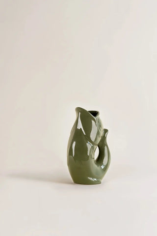 Craquez pour la célèbre carafe GlouGlou kaki brillant de la Manufacture de Charolles chez CQFD Avignon. 100% fait main en France. Pièce iconique !