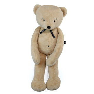 Offrez l'exceptionnel Ours Méloé de 50 cm en coloris beige. Peluche artisanale de luxe faite main en Bretagne. Douceur XXL, qualité héritage et certificat inclus.