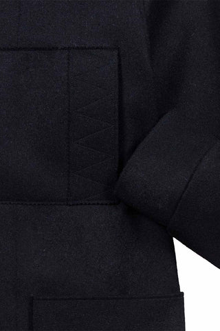 Découvrez le Kabig Le Minor pour homme. Réédition du modèle iconique de 1947 en drap de laine historique. Fabriqué en Bretagne. Un manteau légendaire chez CQFD.