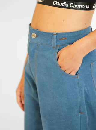 Découvrez le pantalon "Jean" Bleu Baltik de Claudia Carmona chez CQFD Avignon. Un pantalon large modulable en salopette ou combinaison, en coton bio recyclé.