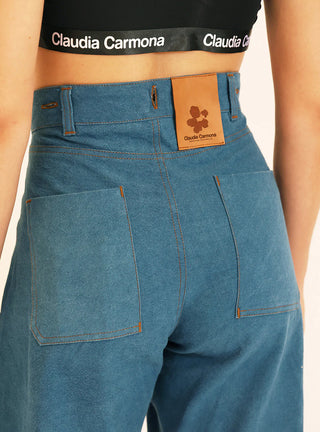 Découvrez le pantalon "Jean" Bleu Baltik de Claudia Carmona chez CQFD Avignon. Un pantalon large modulable en salopette ou combinaison, en coton bio recyclé.