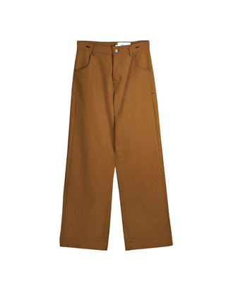 Découvrez le pantalon "Jean" Chicorée de Claudia Carmona chez CQFD Avignon. Un pantalon large modulable en salopette, en coton bio recyclé et teinture naturelle.