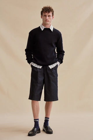 Découvrez le pull marin Le Minor en 100% laine mérinos bleu marine. Un chandail iconique fabriqué en Bretagne, alliant douceur extrême et élégance navale. Qualité EPV chez CQFD.