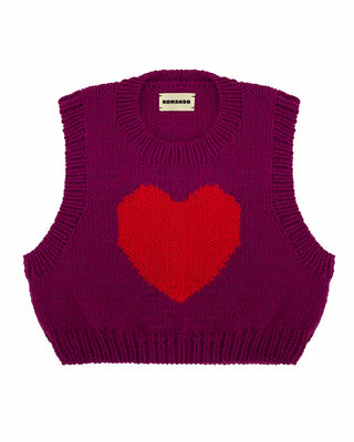 Craquez pour le pull sans manches Cœur Fuchsia ROMANDO. Un modèle en laine mérinos d'exception (EPV), tricoté main en France et ultra-pop chez CQFD Avignon.