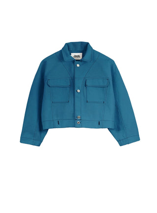 Découvrez la veste "Paca" Bleu Baltik de Claudia Carmona chez CQFD Avignon. Une veste boxy en coton bio recyclé, teinte à l'indigo naturel et modulable en combinaison.