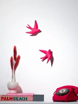 Hirondelle volage en ceramique rose fluo